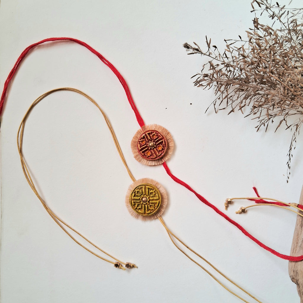 HAnd-made Papier-mache Twin Swastika Rakhi-Red & Yellow Ochre